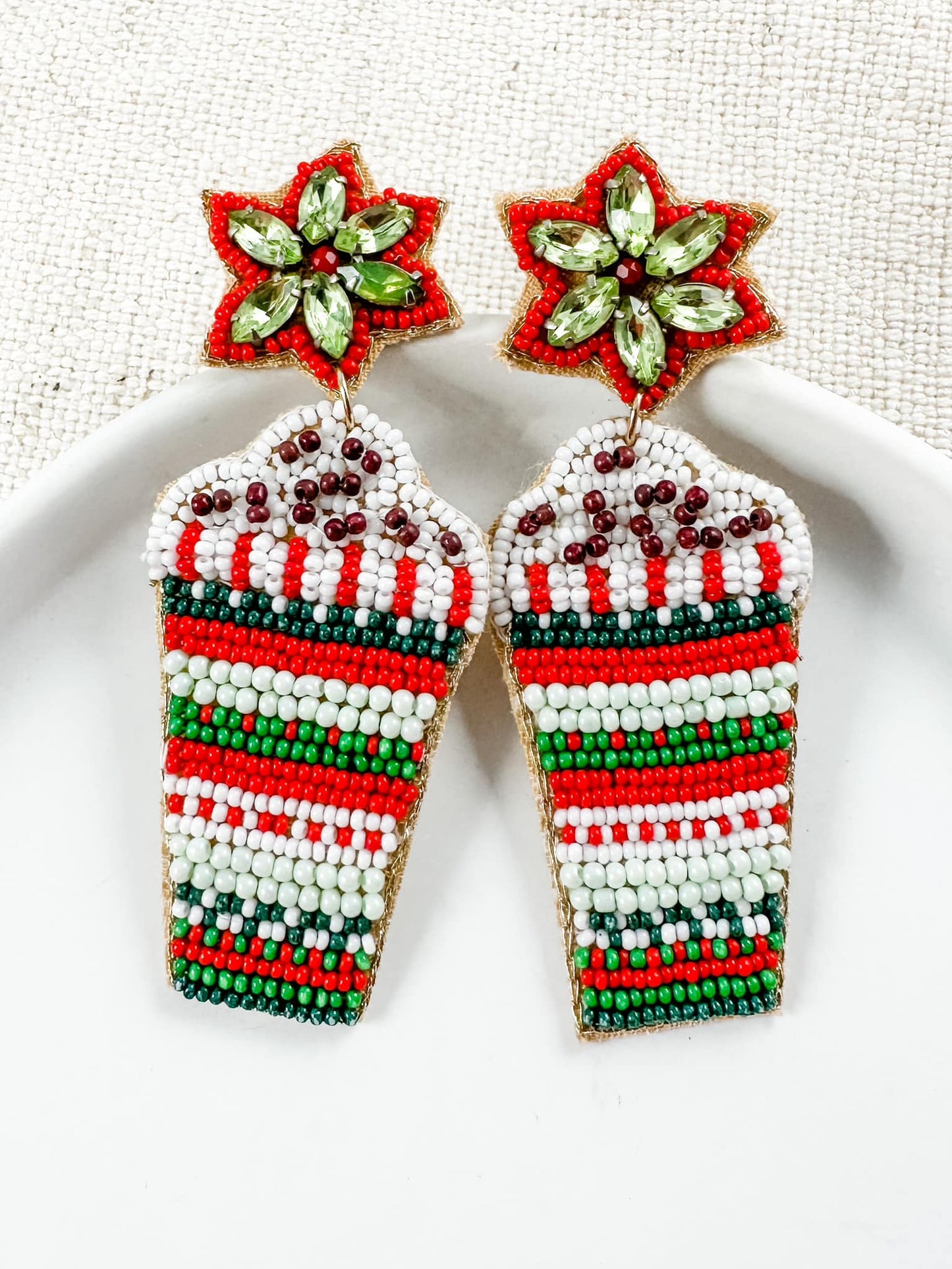 beaded Christmas earrings shaped like festive cups with red, green, and white beads and jeweled star toppers