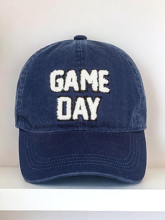 A navy blue chenille cap with the text 'Game Day' embroidered in white on the front.