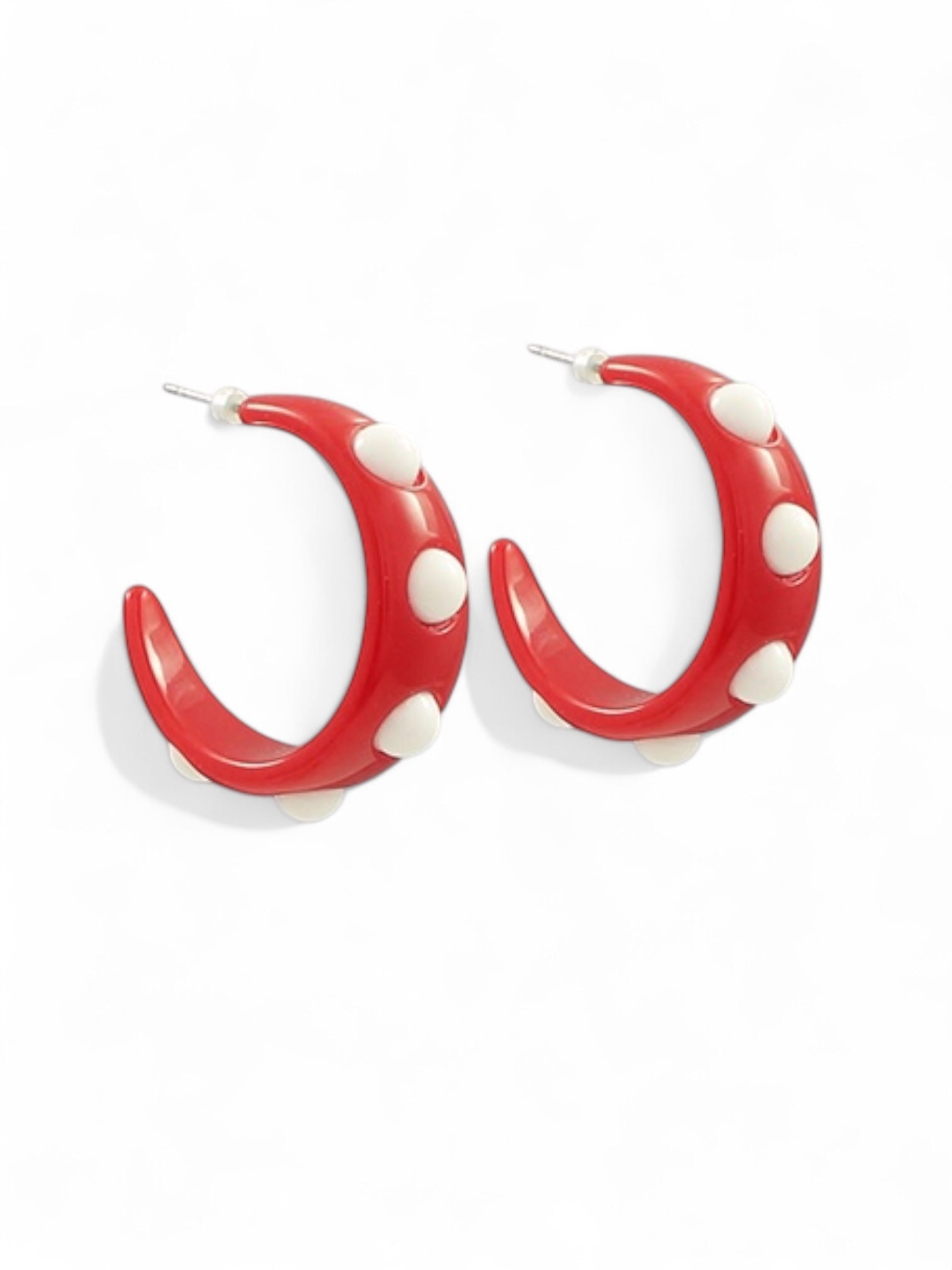 Red and white resin hoop earrings with raised dot pattern displayed on white background