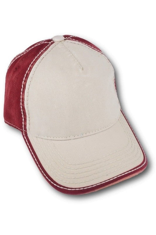 Front angled view of cardinal red and ivory two tone washed baseball cap with curved brim and contrast stitching.
