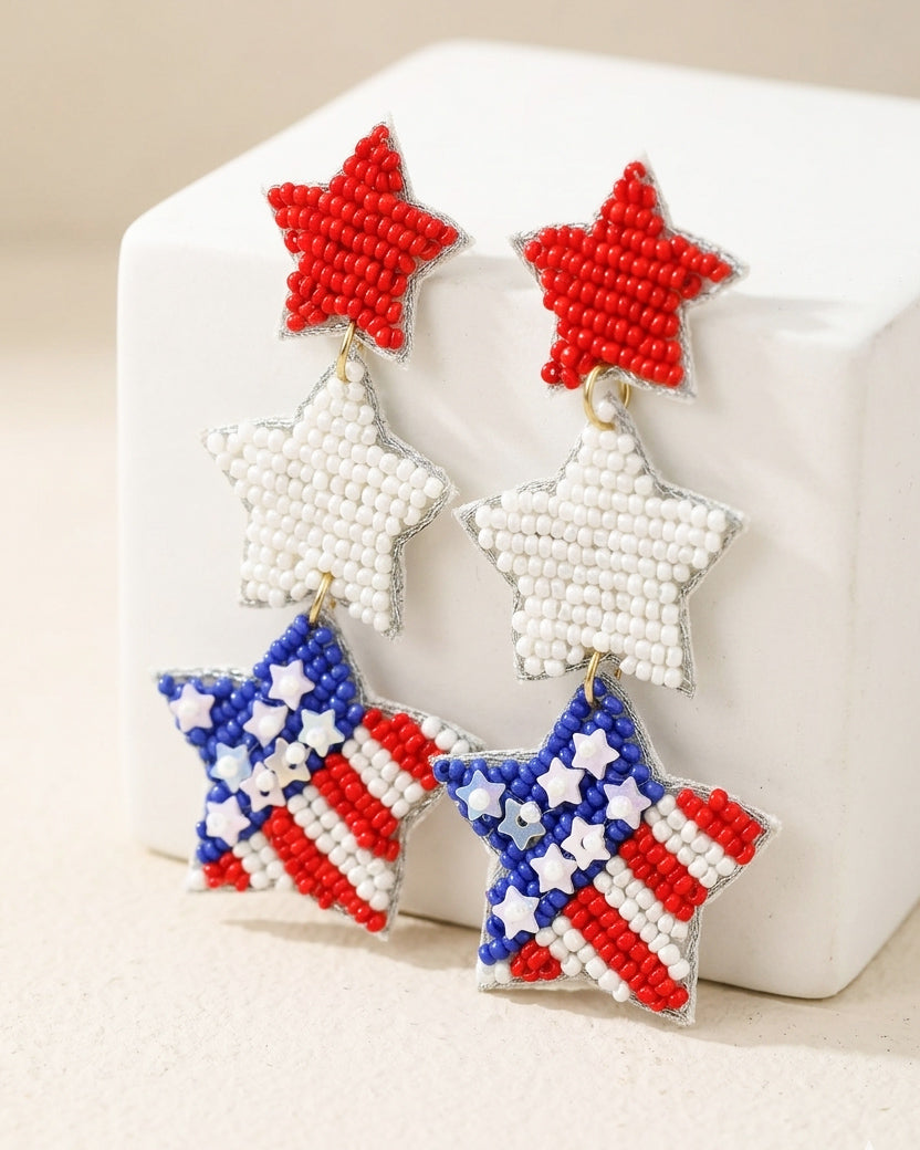 Lightweight patriotic seed bead earrings with layered red white and blue star design