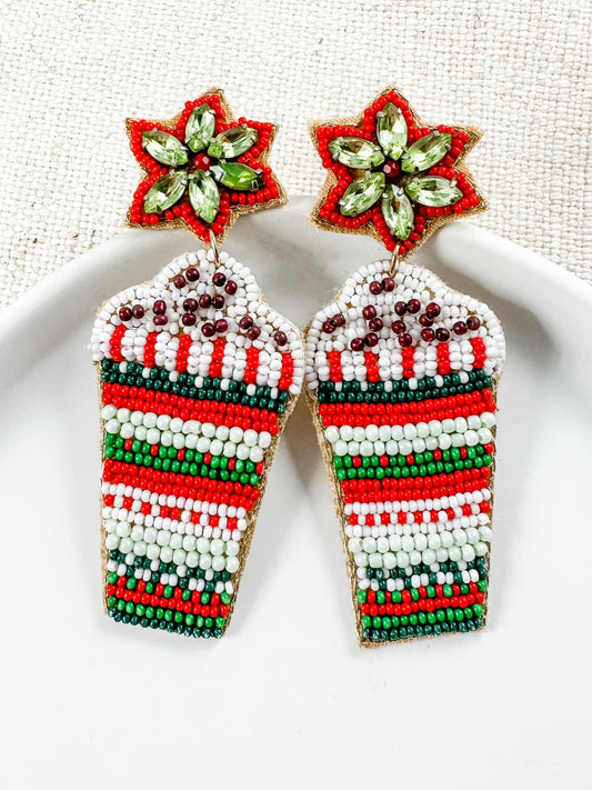 beaded Christmas earrings shaped like festive cups with red, green, and white beads and jeweled star toppers