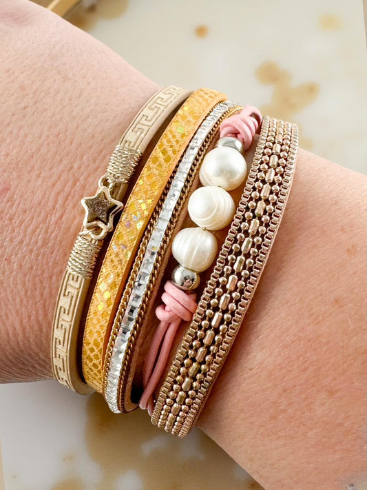 Honey Blush Bracelet stacked on wrist — multi-strand magnetic bracelet with star charm, pearl accents, and mixed blush, gold, and cream bands. Elegant layered bracelet from Anabelle+Oak, perfect for everyday wear or gifting.