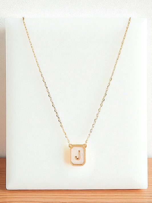 Radiant Bound Necklace featuring gold rectangular pendant engraved with the letter J on a delicate 16-inch chain with extender — minimalist personalized gold necklace from Anabelle+Oak, perfect for layering and everyday wear.