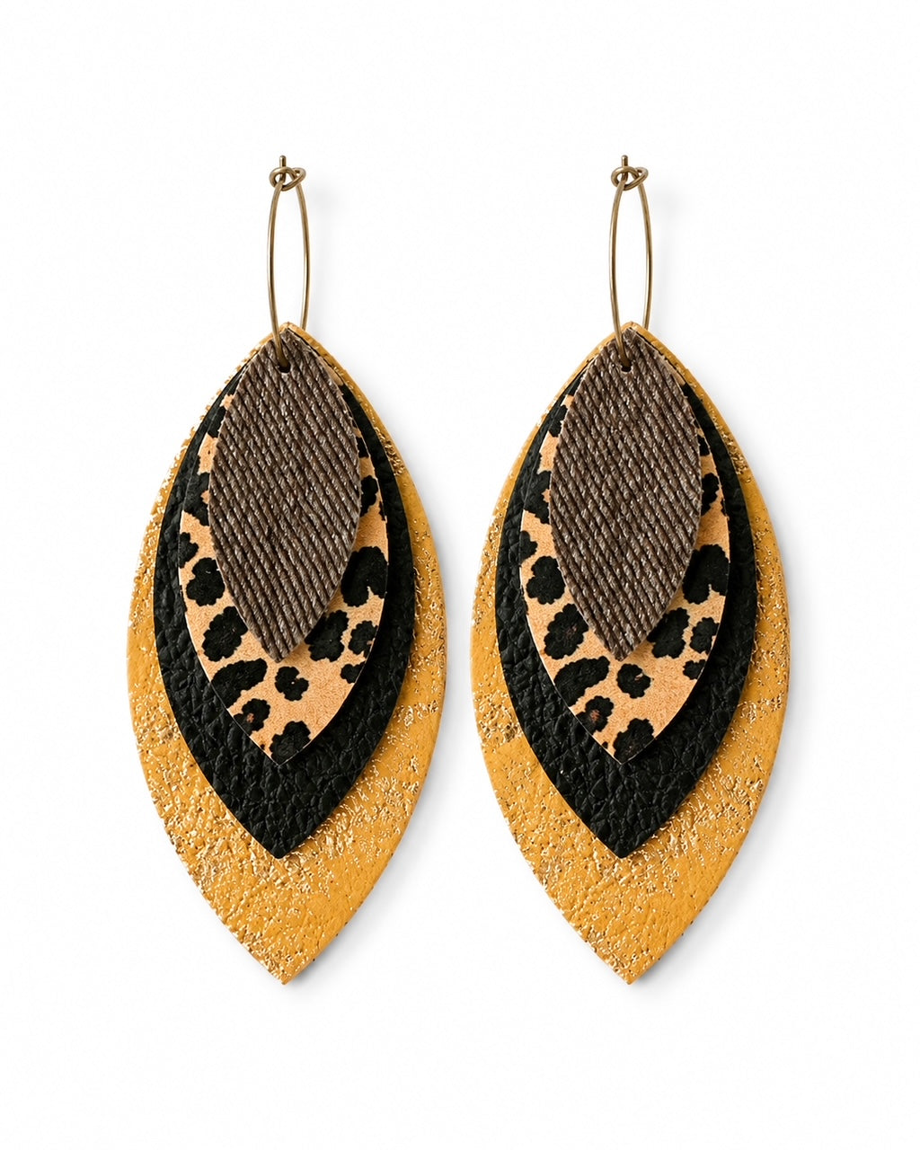 Layered leopard, black, textured brown and metallic gold statement earrings on a clean white background.