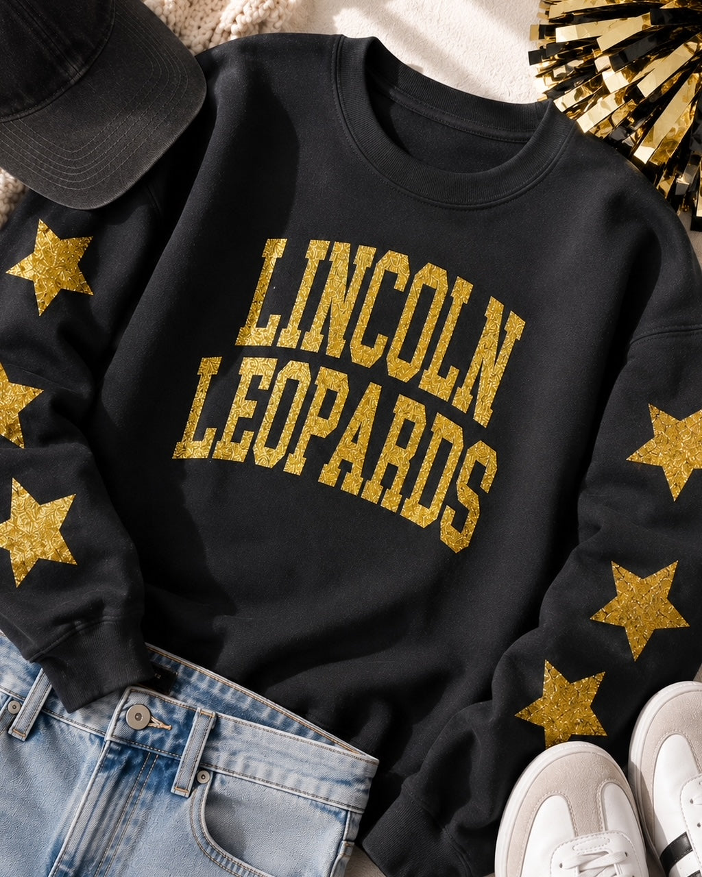 All-Star Leopard Sweatshirt styled with light-wash jeans, white sneakers, and a black hat
