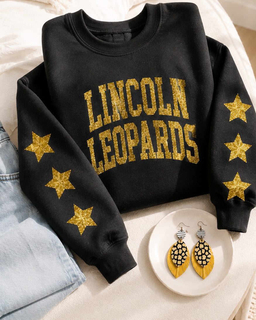 All-Star Leopard Sweatshirt styled with coordinating Wild Card Earrings and light-wash denim