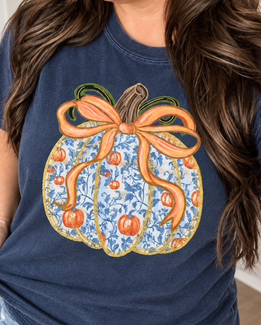 Woman wearing Belle of the Patch blue floral pumpkin tee in Midnight Comfort Colors