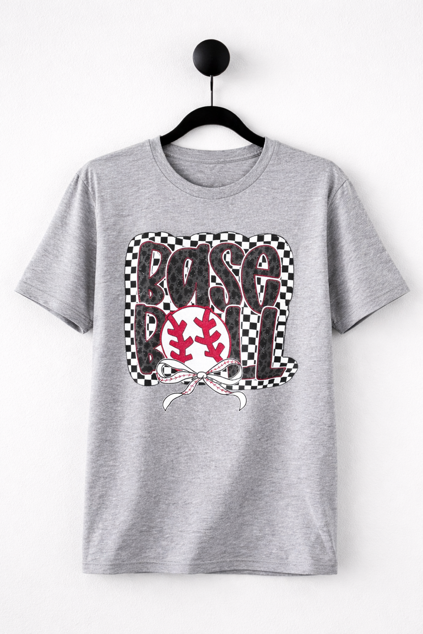 Heather gray short sleeve graphic tee on black hanger with checkerboard and leopard print Base Ball graphic and red baseball bow.