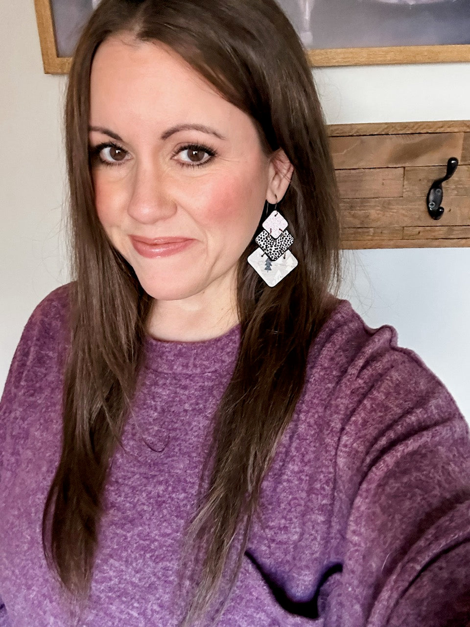 Woman wearing Blush Frost handmade cork and leather statement earrings