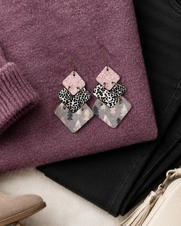 Blush Frost winter statement earrings styled with a plum sweater for the holidays