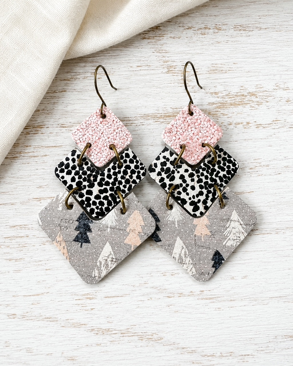 Handmade blush pink cork and genuine leather winter earrings with tree print detail
