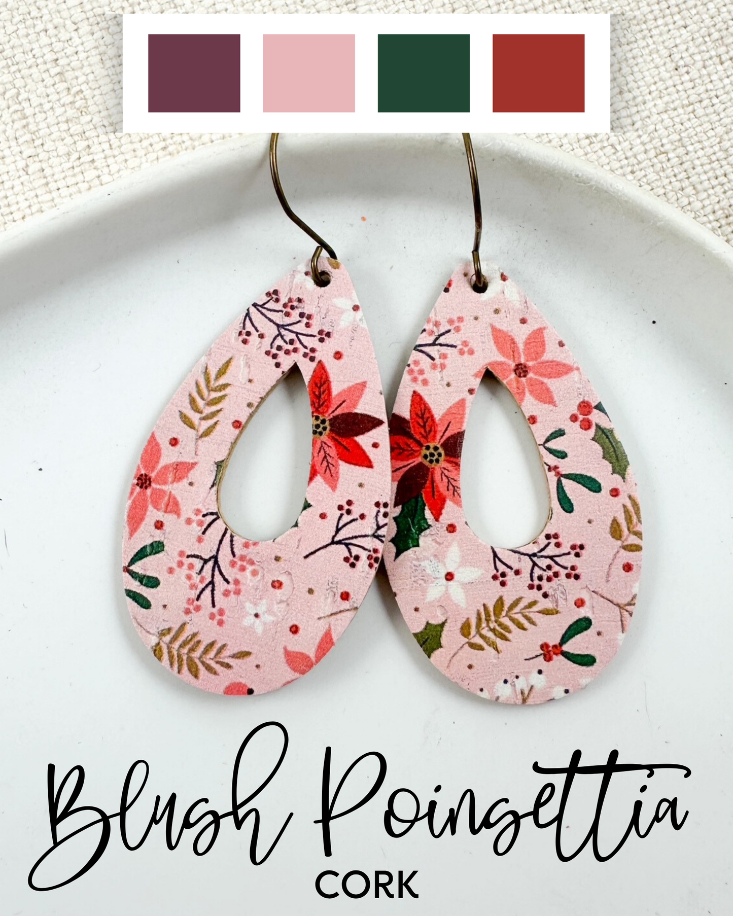 Blush Poinsettia Cork Large Almond earrings shown on a white plate with a coordinating color palette featuring blush pink, wine, deep green, and red tones.