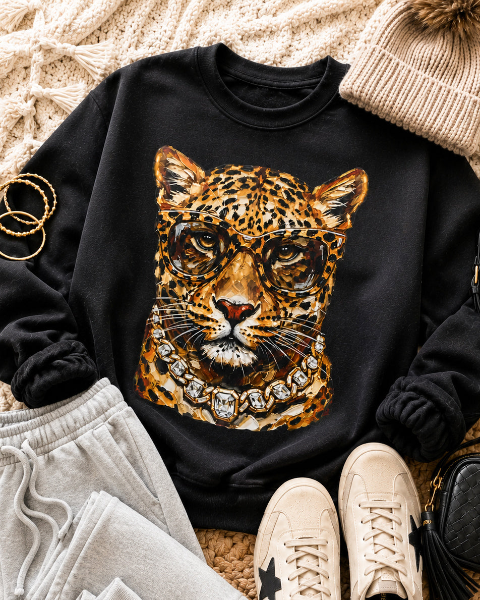 Black Bougie Leopard sweatshirt styled with gray joggers, cream sneakers, a knit beanie, and a black bag