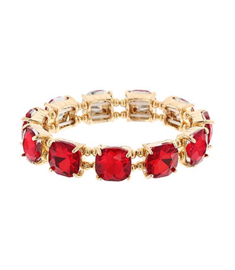 gold stretch bracelet with bright red cushion-cut gemstones on a white background