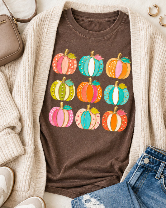 Espresso Comfort Colors pumpkin tee with nine colorful patterned pumpkins styled in a boutique fall flatlay