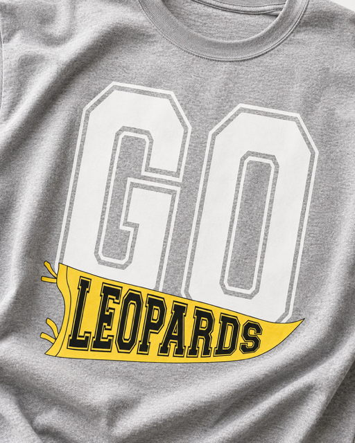 Close-up of the yellow, black, and white GO LEOPARDS flag design printed on sport gray fabric.
