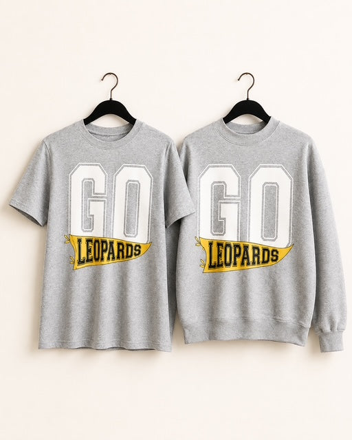 Friday Uniform Shirt shown as a sport gray short-sleeve tee and crewneck sweatshirt with a yellow GO LEOPARDS flag design.