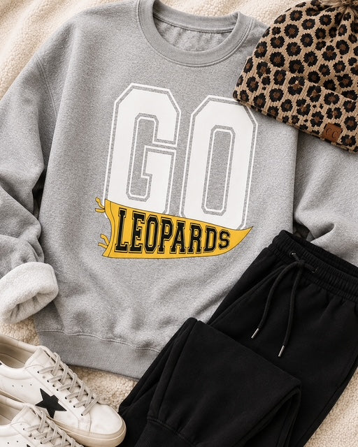 Friday Uniform sweatshirt styled in a casual flat lay with black joggers and coordinating accessories.