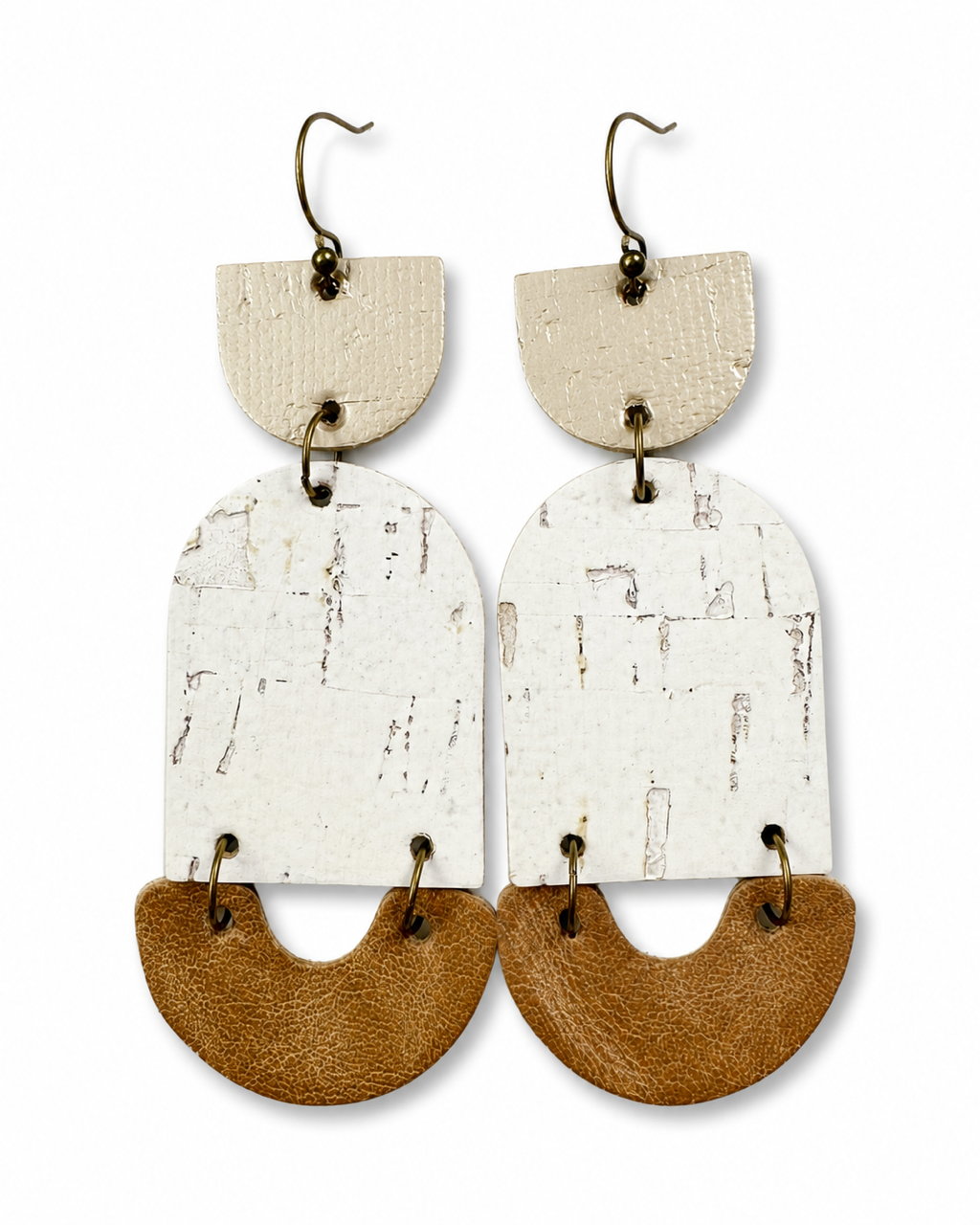 Golden Birch handmade cork and leather statement earrings on a white background.
