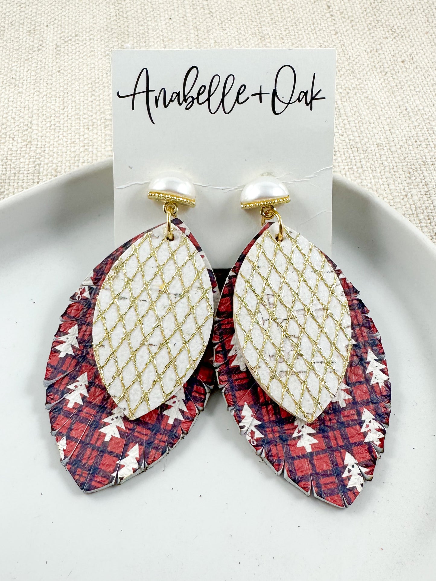 Pearl and gold Christmas tree earrings with layered plaid and gold leather, displayed on a white background.