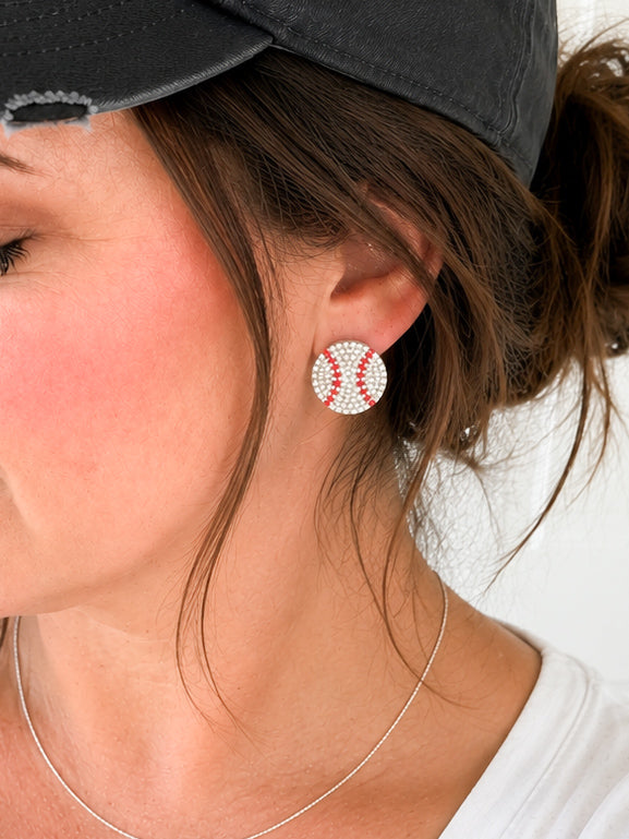 Woman wearing Home Run Luxe rhinestone baseball stud earrings with silver-tone hardware