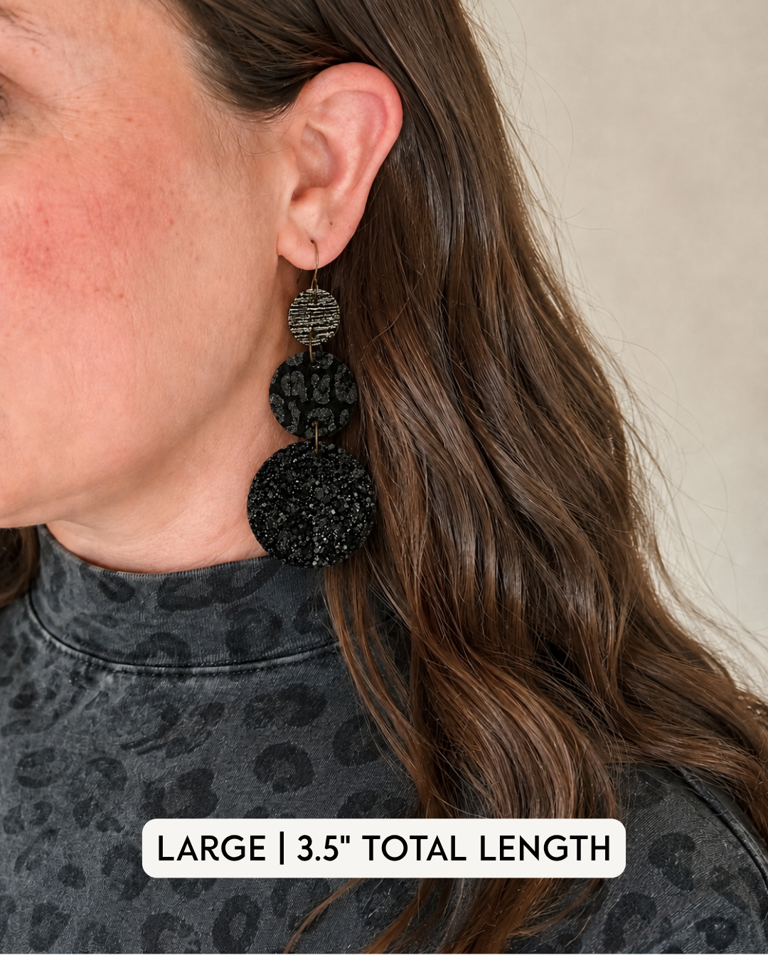Large Inner Circle Earrings modeled to show the 3.5-inch length and scale