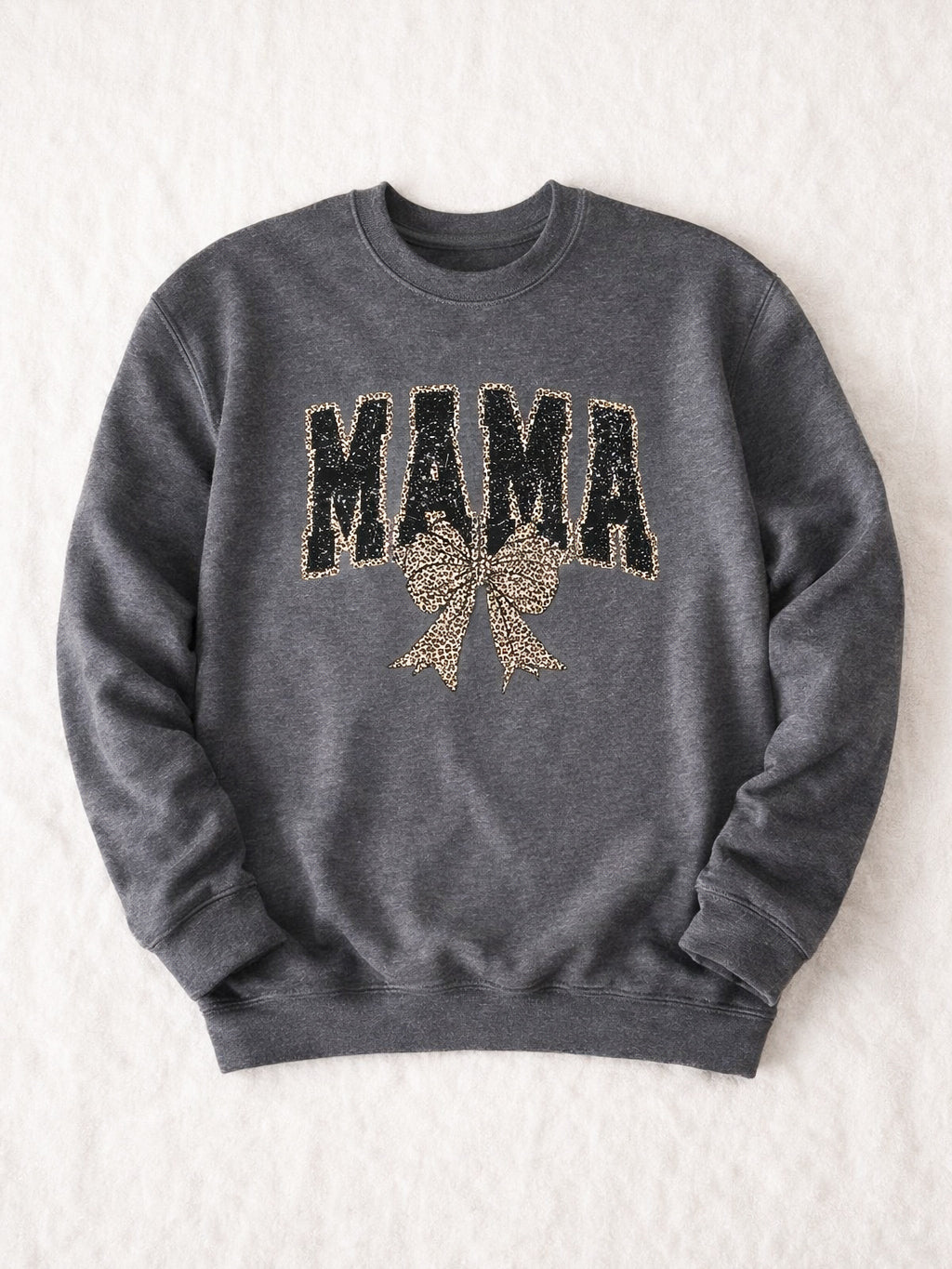 Charcoal unisex crewneck sweatshirt with large MAMA graphic in black distressed print and leopard bow on front.