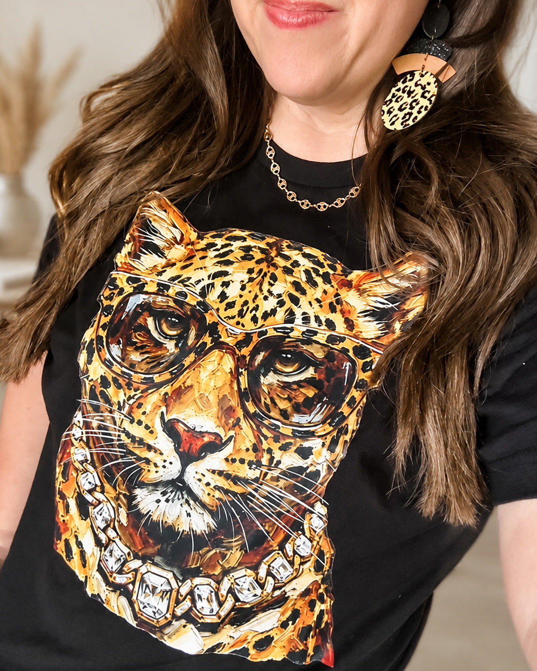 Woman wearing the Bougie Leopard mascot graphic tee in black