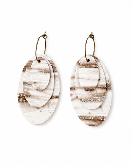 Linen Tide Earrings with three removable marbled genuine leather layers and antique brass-toned hoops on a clean white background.