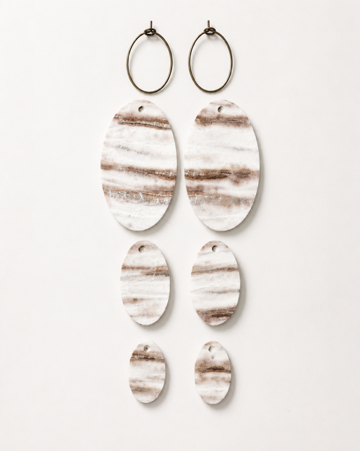 Linen Tide Earrings with antique brass-toned hoops and all three removable genuine leather layers shown separately.