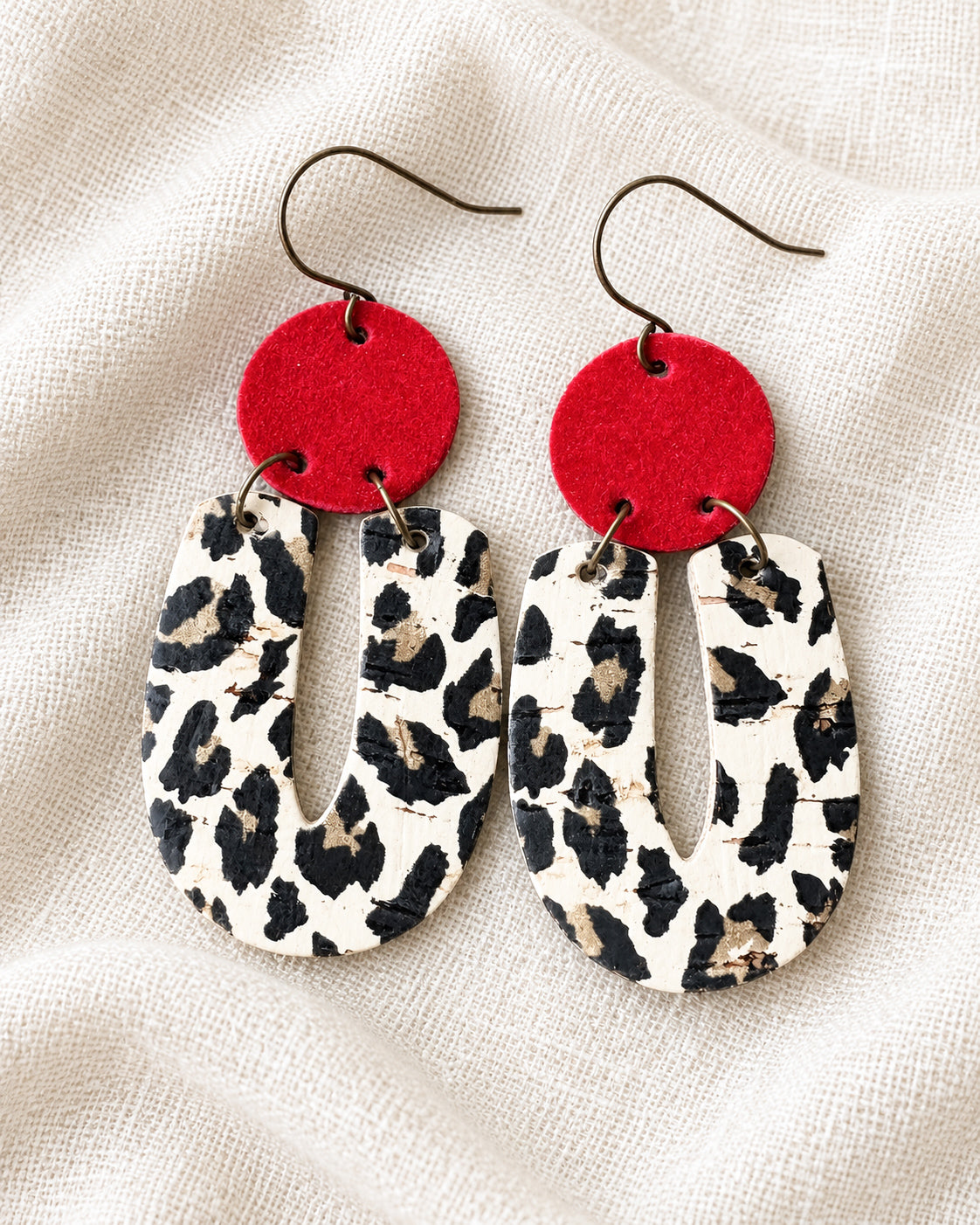 Handmade Red Velvet Leopard Earrings with red suede circles, leopard-print cork drops, and antique-bronze ear wires