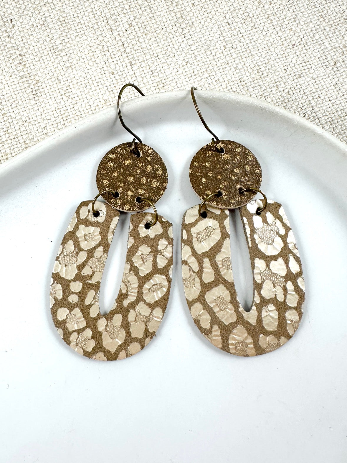 Taupe leather statement drop earrings with worn round top disc and metallic platinum leopard print lower drop, 2.5 inch length