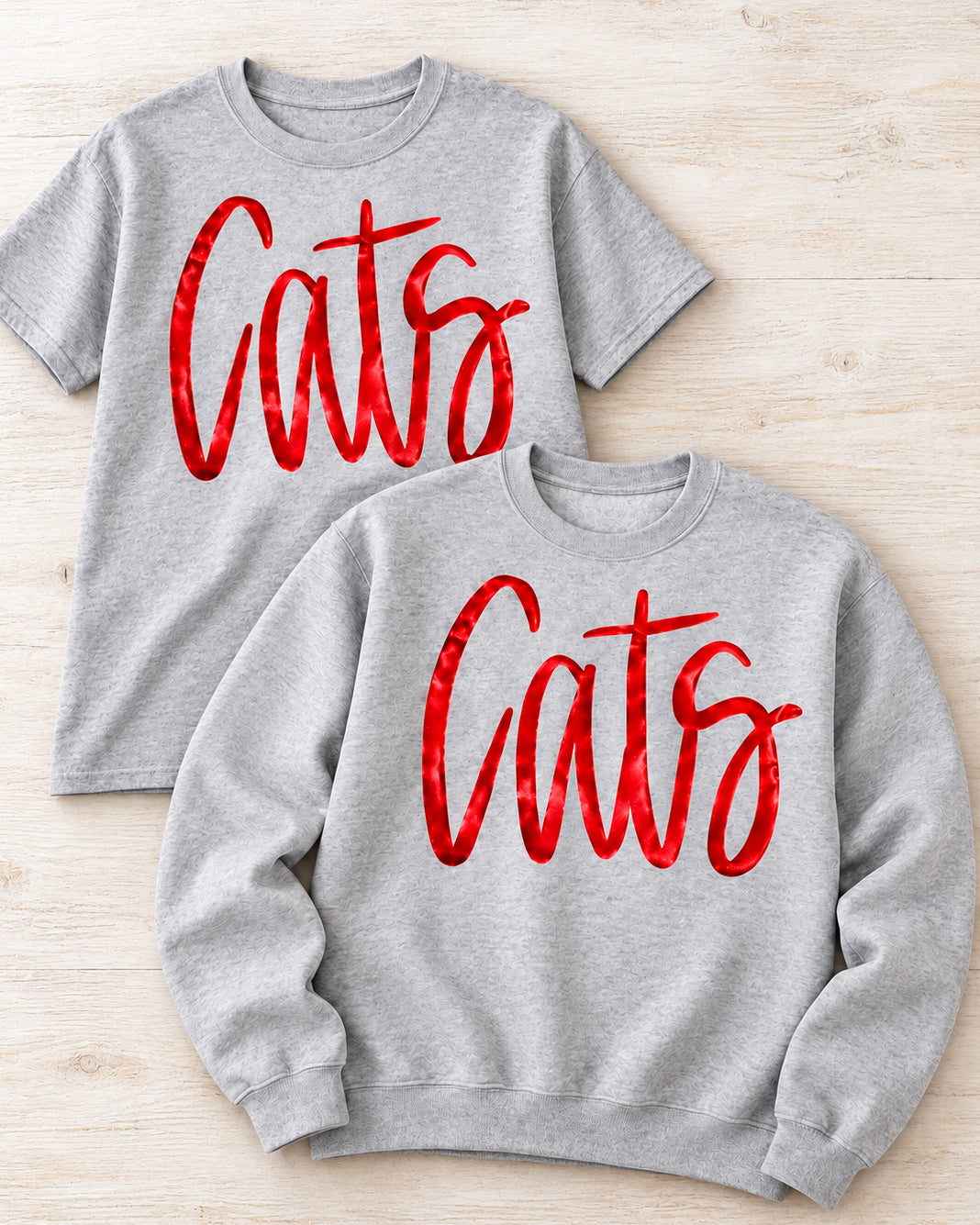 Sport gray Cats graphic tee and crewneck sweatshirt with oversized metallic red script lettering, shown together.