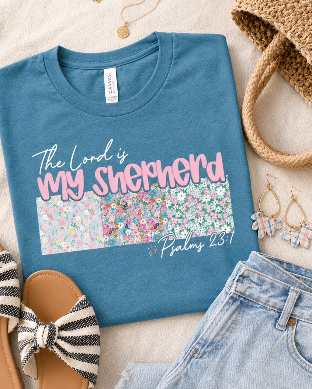 Shepherd's Garden Tee styled with denim jeans and coordinating floral earrings for a casual Christian outfit.