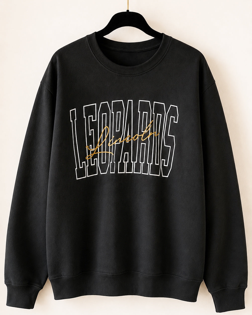 Black Lincoln Leopards crewneck sweatshirt with white outlined varsity lettering and gold script on a black hanger.