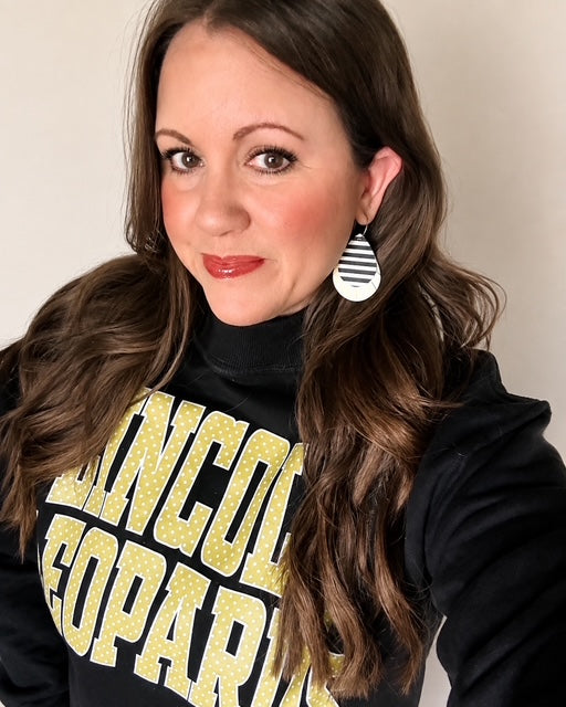 Woman wearing the Legacy Stripe Earrings
