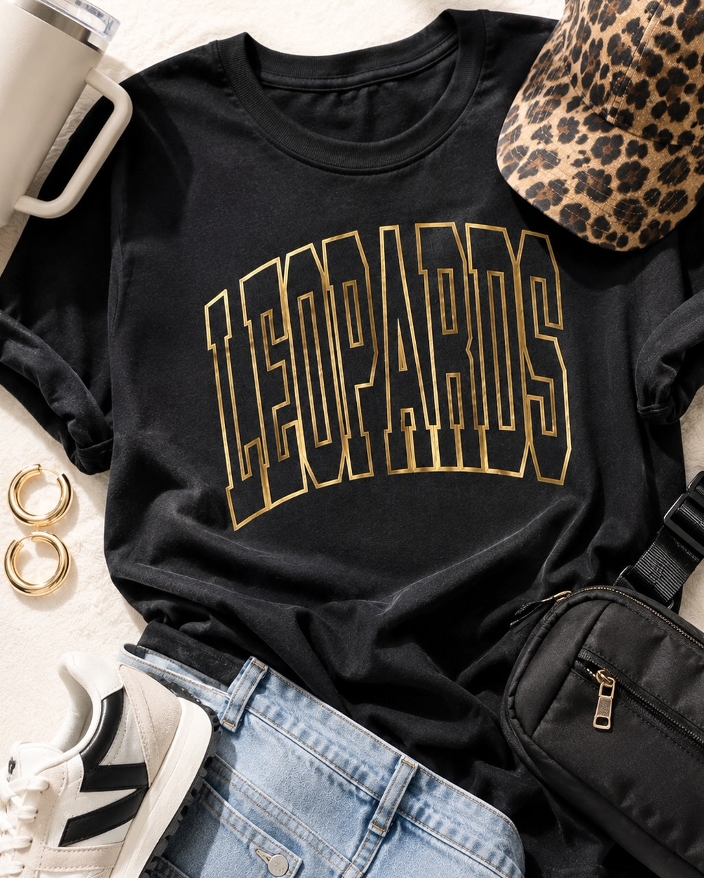 Black Varsity Edit Leopards tee styled with jeans, sneakers, leopard cap and gold earrings
