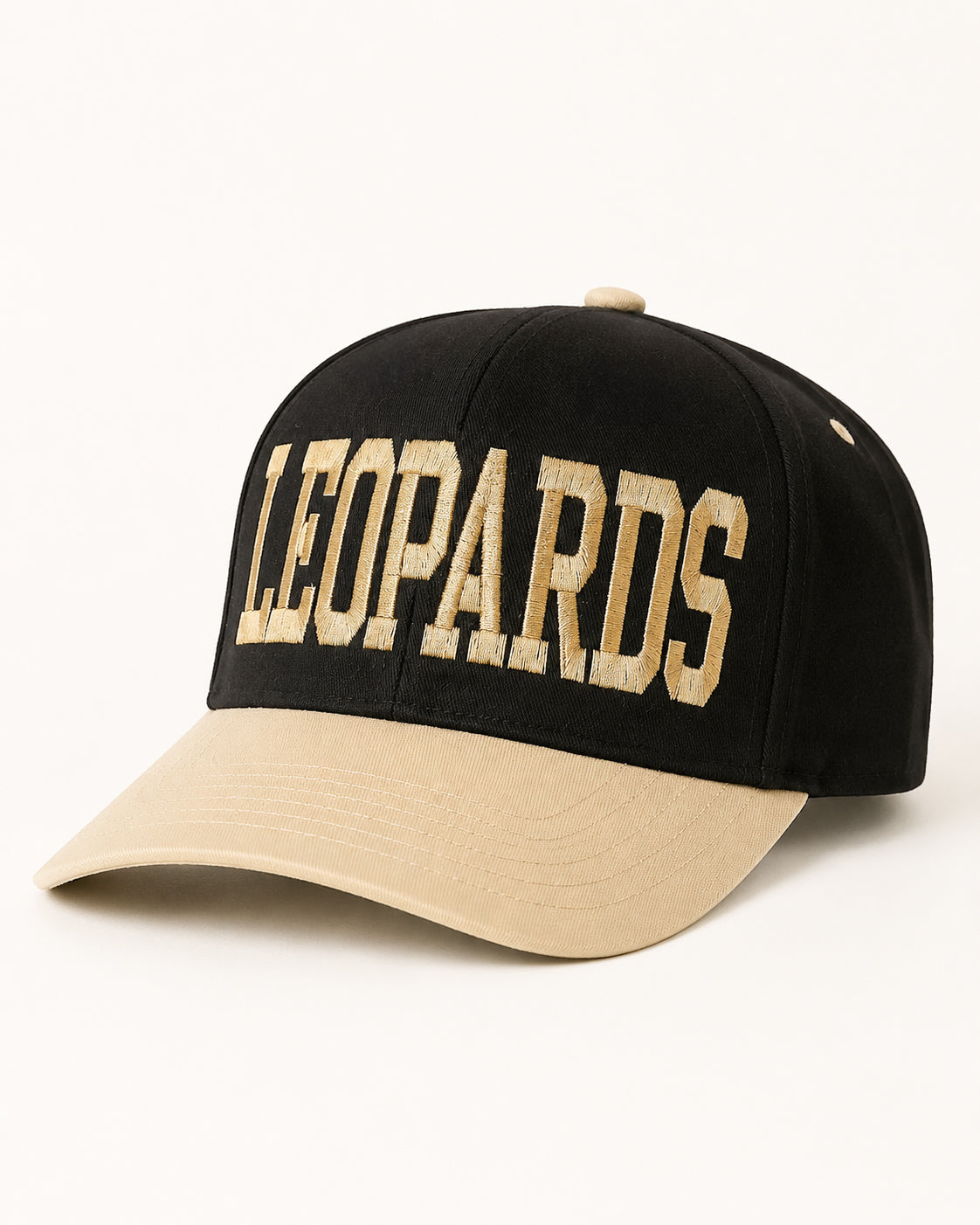 Front three-quarter view of the black-and-ivory Varsity Leopard Hat with oversized LEOPARDS lettering