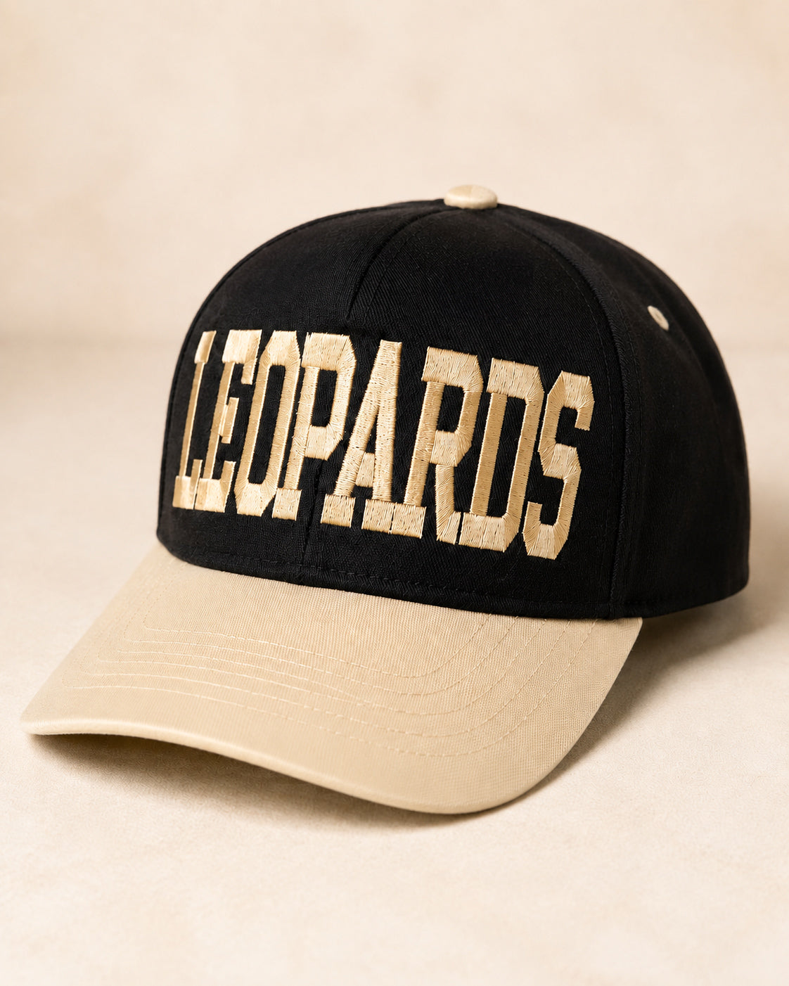 Varsity Leopard Hat with oversized ivory LEOPARDS lettering, black crown, and contrasting ivory bill