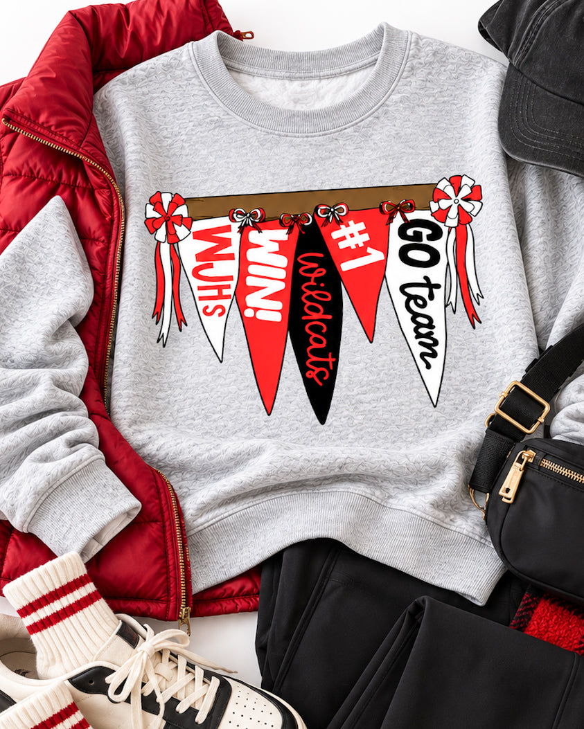 Wildcat Rally Girl sweatshirt styled with a red puffer vest, black pants, sneakers, black cap, belt bag, and plaid blanket.