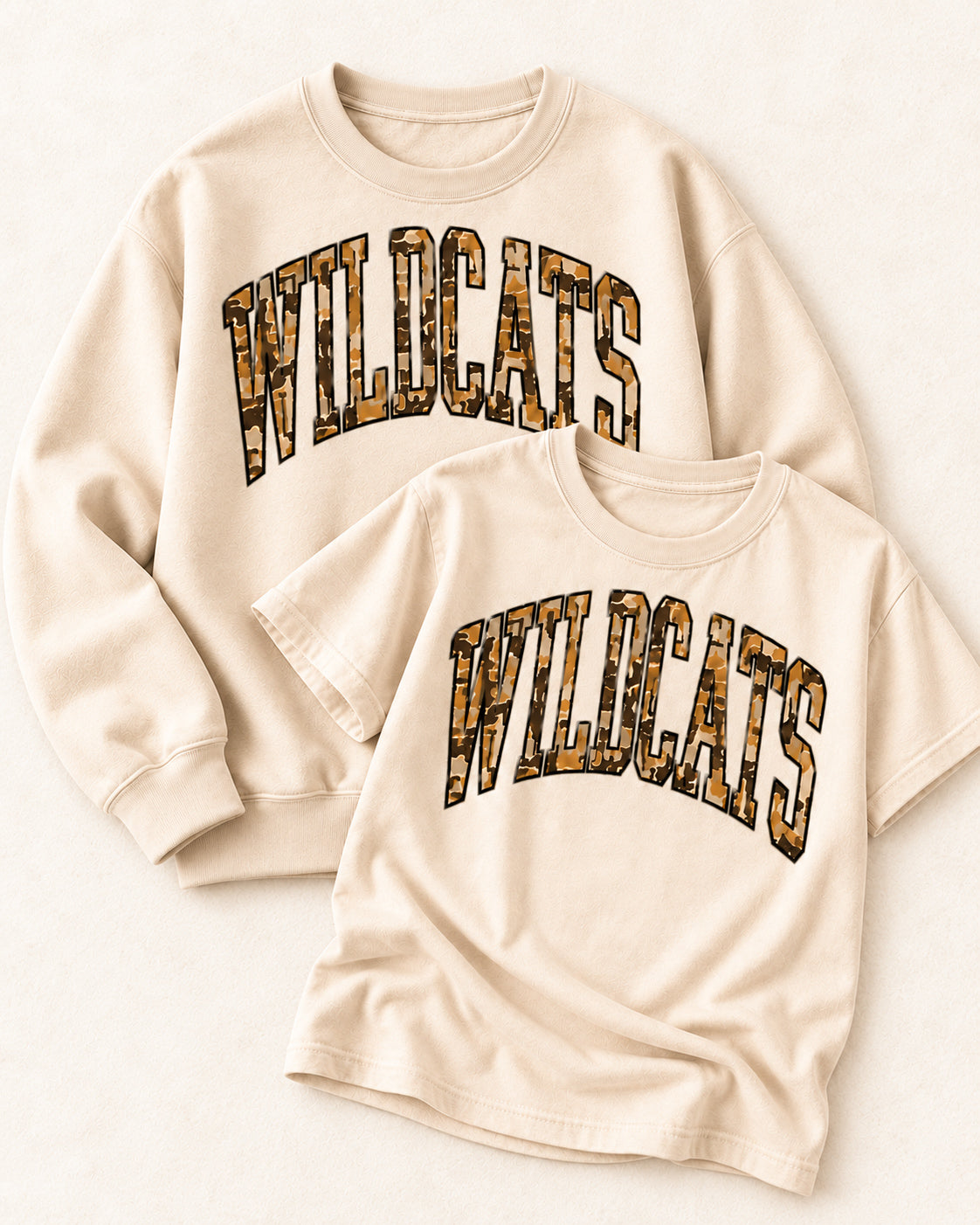 Sand Wildcat Territory tee and sand sweatshirt featuring oversized camouflage WILDCATS lettering.