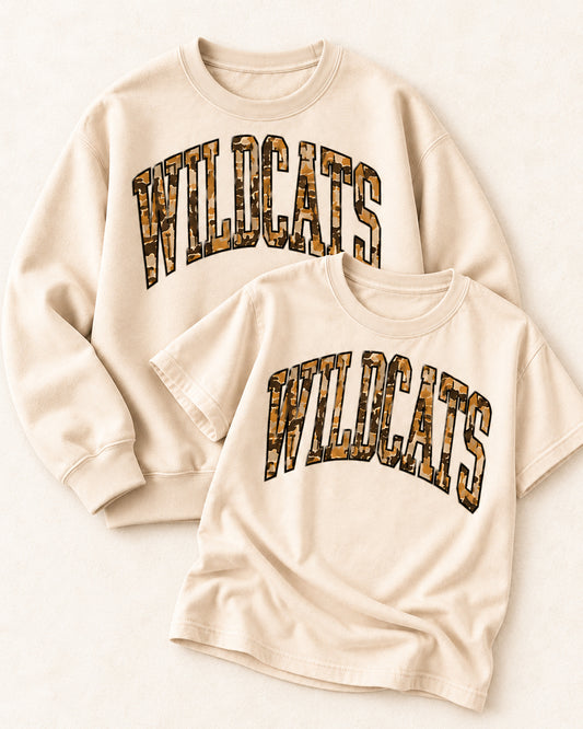 Sand Wildcat Territory tee and sand sweatshirt featuring oversized camouflage WILDCATS lettering.