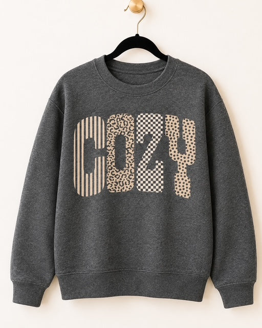 Dark heather gray Gildan Wildly Cozy crewneck sweatshirt with mixed-pattern COZY lettering.